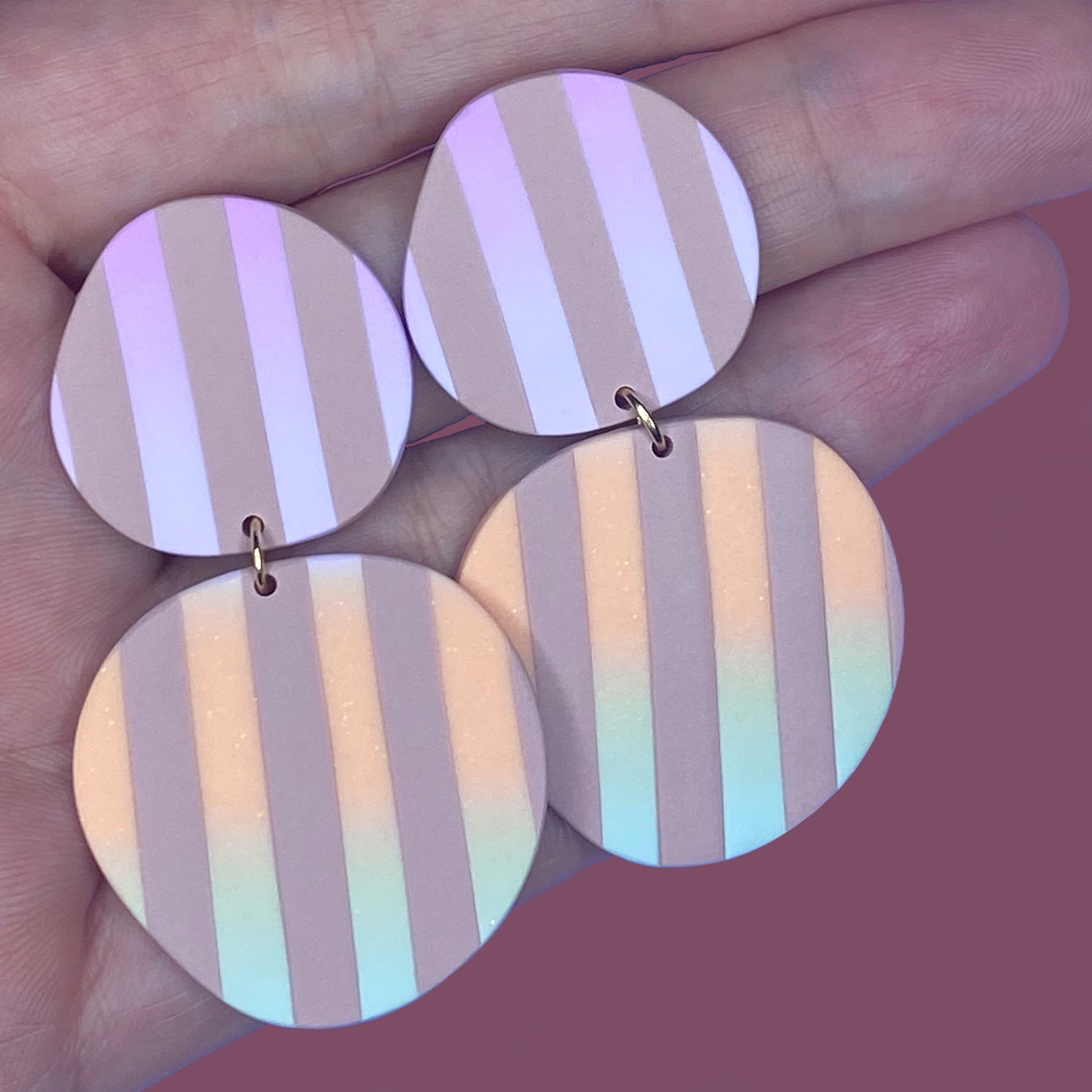 Polymer Clay statement earrings in beautiful modern design. Two organic circles, beige stripes and an ombre going from purple to orange to green.