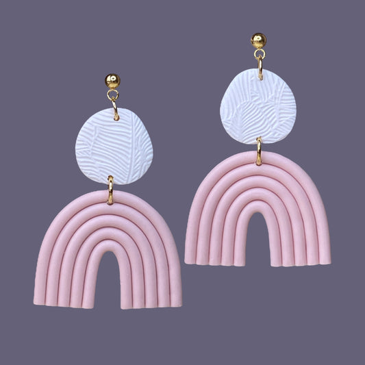 Modern polymer Clay statement earrings in white and pale pink in the trendy rainbow shape